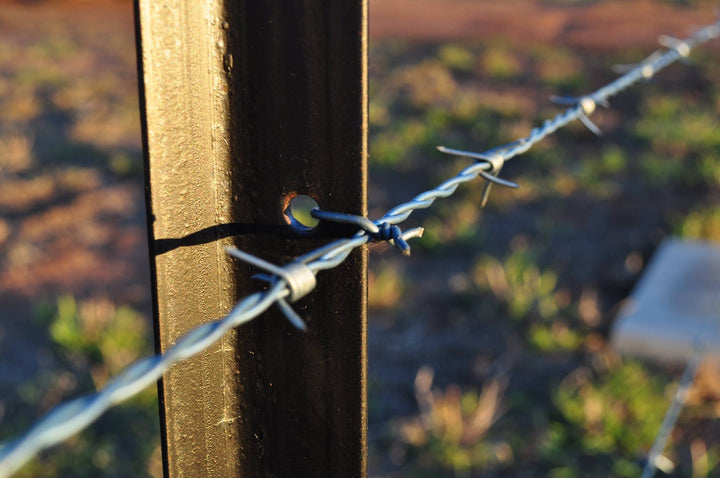 How to tie off barbed wire to a star post